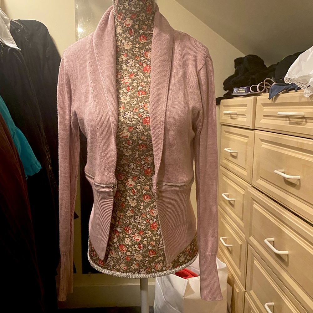 Cute pink cardigan with zipper accent.